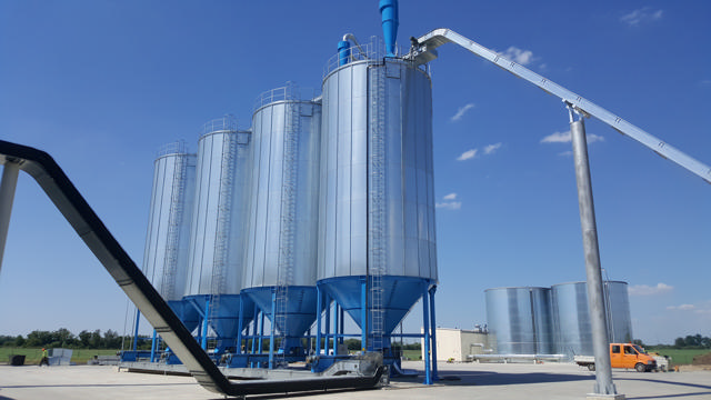 A silo system outside of a industrial building A silo system outside of a industrial building 